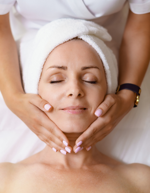 A woman getting pregnancy safe skin treatments