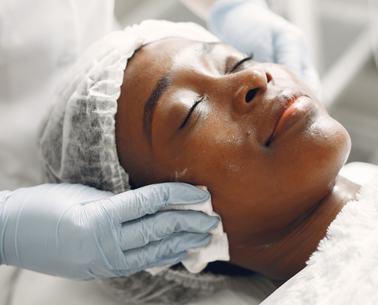 A woman getting a facial at a skin clinic Gloucester